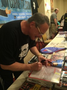 Cornette signing his Midnight Express 25th Anniversary scrapbook (must read).