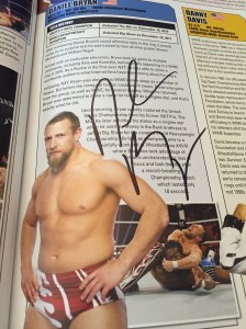 Daniel Bryan's autograph in his entry in the WWE Encyclopedia, Vol. 2.