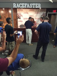 Daniel Bryan signing books and memorabilia for fans 